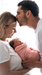 © Anna - Young family, man and woman holding a baby in their arms. Newborn concept.