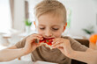 © Elena - Child Enjoying Healthy Snack