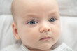 © Michael - Sweet baby, calm in a neutral setting: A sweet baby gaze directly at the viewer. Capturing the purity of newborn infancy and innocence.