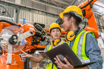 robotic engineer training, technician work in modern factory industrial robot welding arm machine co