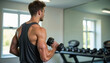 ©  VladaToday - Fitness enthusiast lifting dumbbells in gym with mirror reflection and equipment in background