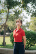 © Jirawatfoto - Southeast asian woman young female entrepreneur enjoys remote work as small business owner businesswoman standing outdoors in park with confident smile