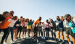 © Jacob Lund - Diverse group of runners cheering for race day encouragement