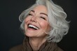 © Iftikhar alam - Joyful senior woman laughing against a dark background, showcasing vibrant personality and elegance, Beautiful senior woman portrait mid 50s laugh, Female models beauty face care, Cosmetology