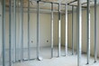 © EchoFrame - Interior framing installation in new home construction site showing metal studs and framework for walls and ceilings
