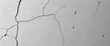 © chonlada - Cracked, grey concrete wall; distressed cement texture with holes,  aged,  concrete wall