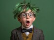 © Duskcraft - Surprised boy with green hair and glasses in studio shot expressing shock and awe in a close up portrait against green background