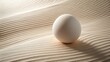 © mamun - Round Egg on Minimal White Desert Dunes