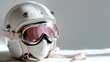 © rashyn - Vintage-style motorcycle helmet with pink-tinted goggles on mannequin head, studio shot