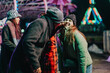 © qunica.com - Joyful gathering of friends enjoying a night out at an illuminated carnival, capturing their happiness and fun times together during a beautiful evening filled with laughter, warmth, and lively colors