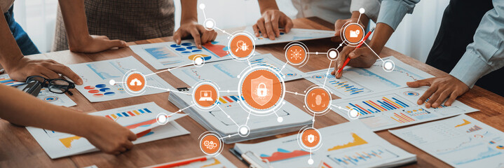 Fototapete - Analyst team utilizing BI Fintech to analyze and pointing at financial dashboard paper office. Businesspeople examining report paper on table for business insight. Panorama shot. Scrutinize Amity