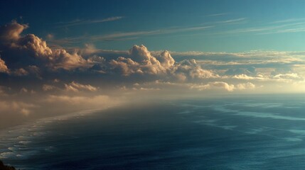 Wall Mural - a panoramic image of a vast body of water, adorned with an array of clouds above, and a minor amount
