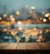 © k_viktar - Wooden table with blurred city skyline and world map background in bokeh effect