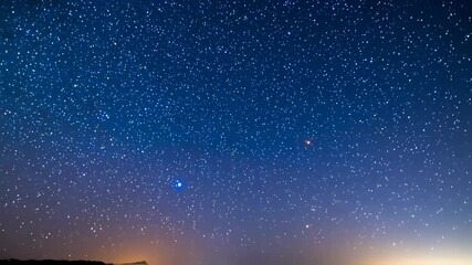 Wall Mural - night sky filled with countless stars glittering above a dark landscape, a breathtaking cosmic view 