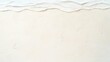 © Suroart - Textured beach scene; waves, sand, footprints.