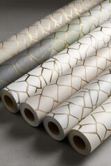Aufkleber - Close-up of Wallpaper Rolls with Geometric Gold Pattern in Neutral Colors for Interior Design and Home Decor Projects