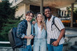 © Zamrznuti tonovi - Happy university students smiling together on campus