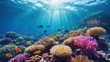 Colorful coral reef under clear blue water with sunbeams shining through the surface ocean, surrounded by a variety of tropical fish swimming peacefully in a vibrant and thriving marine ecosystem.