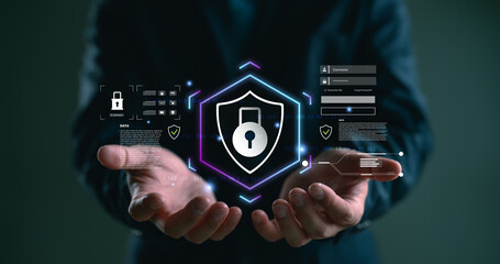 Leinwandbilder - Cybersecurity and data protection concept. A businessman holds a digital shield with lock icon, login form, and binary code, representing online privacy, secure access, and information safety.