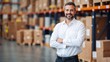 © VistaVisions - Smiling logistics manager posing in warehouse. Transportation storage delivery shipment saleman success concept
