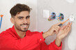 © auremar - young electrician on electrical installation