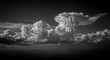 © Epic Photo - Celestial Glyphs in Cumulus Clouds - Dramatic black and white of fluffy cumulus clouds with abstract glyphs etched into them, creating a surreal and mysterious scene