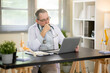 © Kittipong - The doctor is talking to the patient about treatment options via video conference.