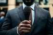 © Pangestu - Close-up of a reporter's microphone in the hands of a correspondent in a gray or dark blue suit