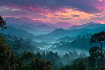 Aufkleber - Morning mist envelops mountainous landscape with vibrant sky at dawn in tranquil setting