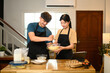 © Prathankarnpap - Romantic couple couple prepares breakfast in warm kitchen
