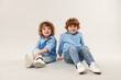 © New Africa - Cute little brothers together on light background