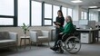 © Muhammad Shoaib - office, professional office environment, business setting, two people in wheelchairs, smiling, positive attitudes, windows, modern decor, collaborative workspace