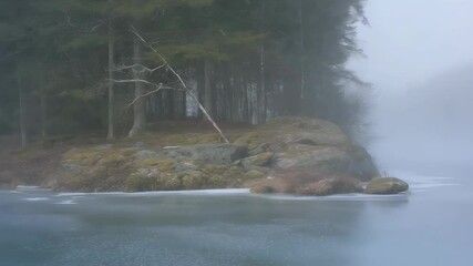Wall Mural - lone hiker traversing frozen lake surface, surrounded by misty forest landscape, creating ethereal s