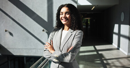 Poster - Smile, portrait and confident business woman in company for opportunity as talent acquisition specialist. Arms crossed, professional and happy human resources worker in corporate office in in Mexico