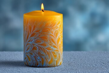 Aufkleber - Bright yellow candle with intricate design glowing softly in a calm blue background setting