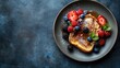 © Lasvu - French challah toast with berries and syrup on a plate with space for text or design