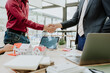 © Kritdanai - Real Estate Deal Handshake in Office