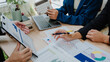 © Kritdanai - Business Team Analyzing Financial Data