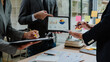 © Kritdanai - Business Team Analyzing Financial Data on Tablet