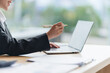© Kritdanai - Businesswoman Working on Laptop at Desk