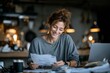 © Khai - Woman Reviewing Finances at Home, Smiling