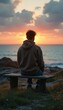 © vadosloginov - Thoughtful Man on Bench at Sunset, Contemplating the Ocean View and Natural Beauty