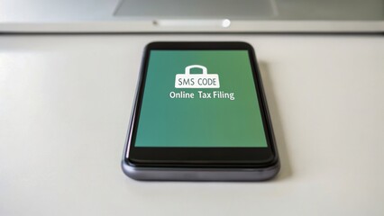 a mobile device displaying an sms code for online tax filing, emphasizing digital finance and modern