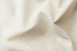 © reddish - Natural beige fabric textile with soft folds and texture close up