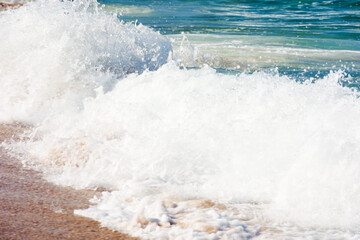 Wall Mural - sea foam on the sandy beach. scenic aqua splash. closeup nature background on a sunny afternoon. sum
