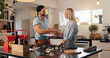 © WesleyStudy/peopleimages.com - Woman, man and plumber with handshake in kitchen for thanks, report or deal for repair at house. People, handyman and client with shaking hands for service with smile, inspection or leak at apartment