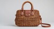 © Sona - Wicker handbag with leather handles and strap. Stylish accessory for daily use and fashion. Handmade woven bag with leather details.