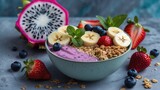 Fresh fruit and oat smoothie bowl topped with banana, strawberry, blueberry, dragon fruit, and mint, served with scattered berries and granola.