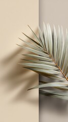 Fototapete - A palm leaf rests against a beige minimal background, creating an elegant and serene atmosphere. The shadows cast by the leaf add depth to the simple yet sophisticated composition.