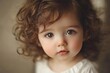 © Oleksandr - Infant Face. Adorable Cute Baby with Curly Hair and Expressive Eyes